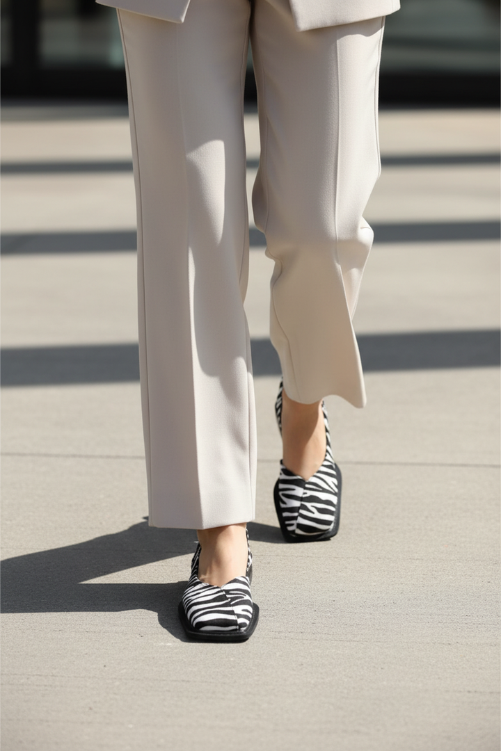On feet street zebra